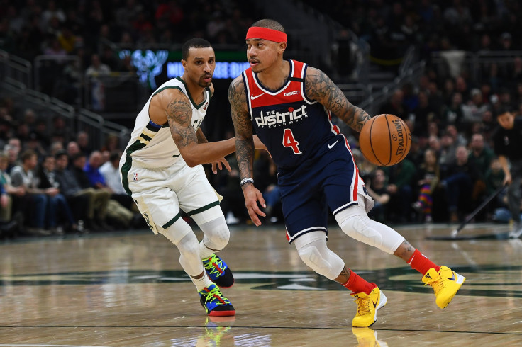  Isaiah Thomas #4 of the Washington Wizards drives around George Hill #3 of the Milwaukee Bucks