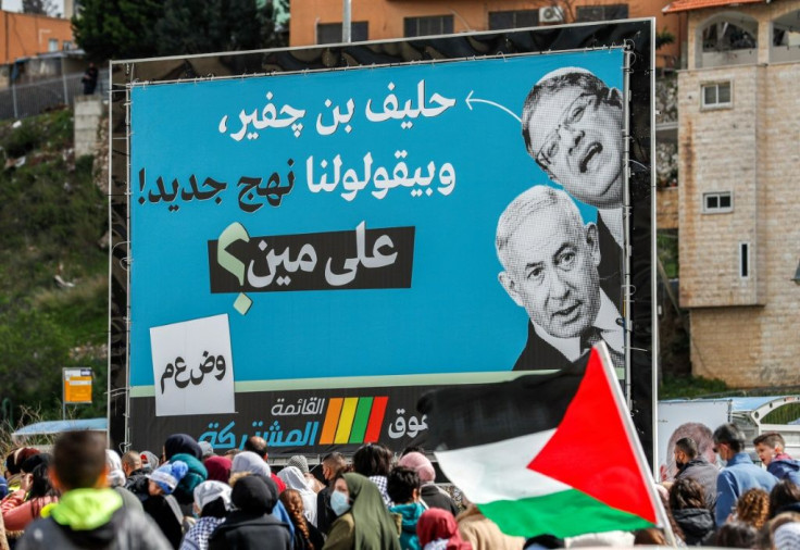 A campaign poster for the Arab-led Joint List says Netanyahu's covert support for Ben-Gvir and his far-right electoral alliance exposes his true colours