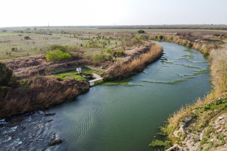 In this aerial photo the river Rio Grande is pictured dividing the cities of Brownsville, Texas (L), and Matamoros, Tamaulipas, Mexico (R) on March 16, 2021