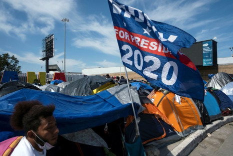 Joe Biden's campaign flag is seen at a migrant camp in Tijuana on the US-Mexico border