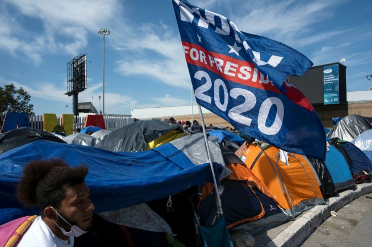 Joe Biden's campaign flag is seen at a migrant camp in Tijuana on the US-Mexico border