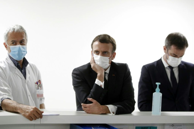 President Emmanuel Macron consults with health experts as millions across France were preparing to enter a new month-long, limited lockdown from Saturday after the country recorded its highest new caseload in nearly four months.