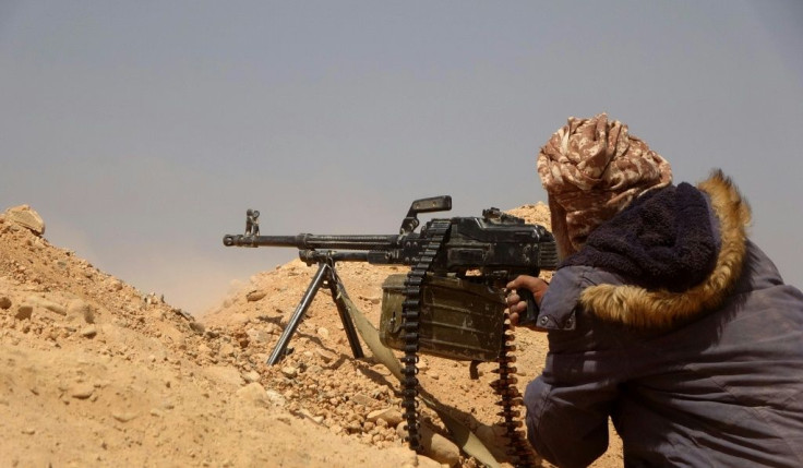 A fighter loyal to Yemen's Saudi-backed government gets into position during clashes with advancing Huthi rebels in Marib province earlier this month