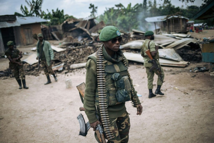 DR Congo troops on patrol in Manzalaho, a village near Beni, after an attack blamed on the ADF