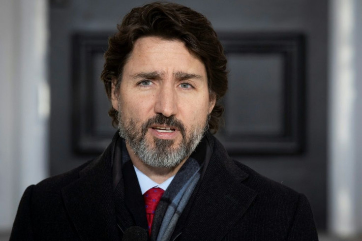 Canadian Prime Minister Justin Trudeau, pictured on March 15, 2021,  has attacked the charges against its citizens as "trumped-up"