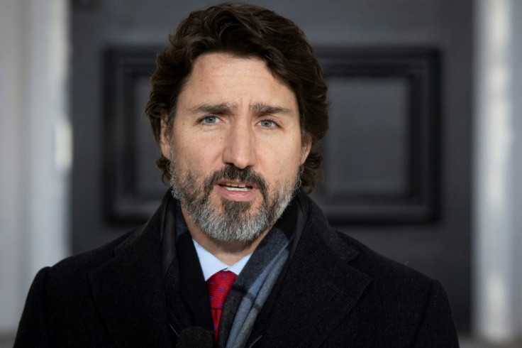 Canadian Prime Minister Justin Trudeau, pictured on March 15, 2021, has attacked the charges against its citizens as "trumped-up"