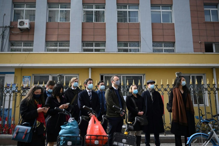 Diplomats from various countries waited outside of the Dandong Intermediate People's Court, where Canadian businessman Michael Spavor stood trial on spying charges, in the border city of Dandong in China's northeast Liaoning province