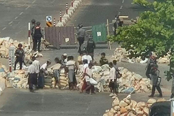 The Myanmar military is forcing civilians to dismantle barricades built by anti-coup protesters for protection against live rounds