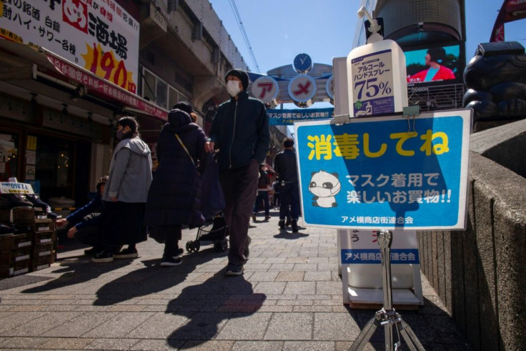 A hand sanitiser dispenser is installed on a street in Ueno shopping district of Tokyo. When the Games were postponed last year, organisers had hoped the pandemic would be receding by spring 2021