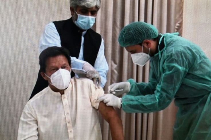 Imran Khan receives a shot of the Chinese-produced Sinopharm vaccine