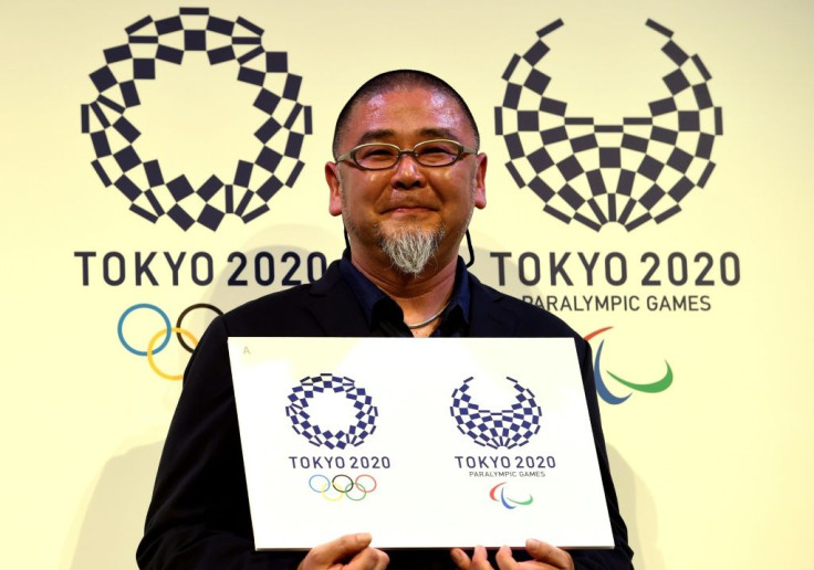 Designer Asao Tokolo holds the new Tokyo Olympics logo after the original had to be ditched following a plagiarism scandal