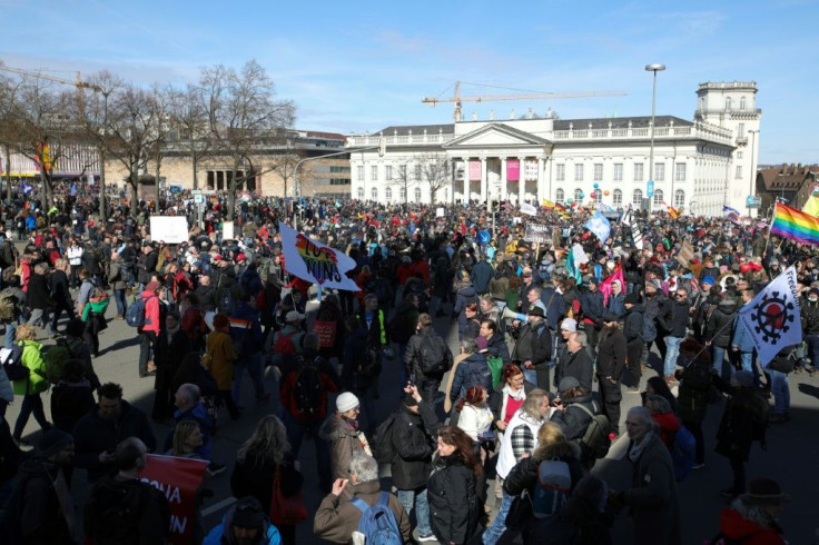 The protest drew in a range of people from the the far-left and conspiracy theory believers to anti-vaxxers and right-wing extremists