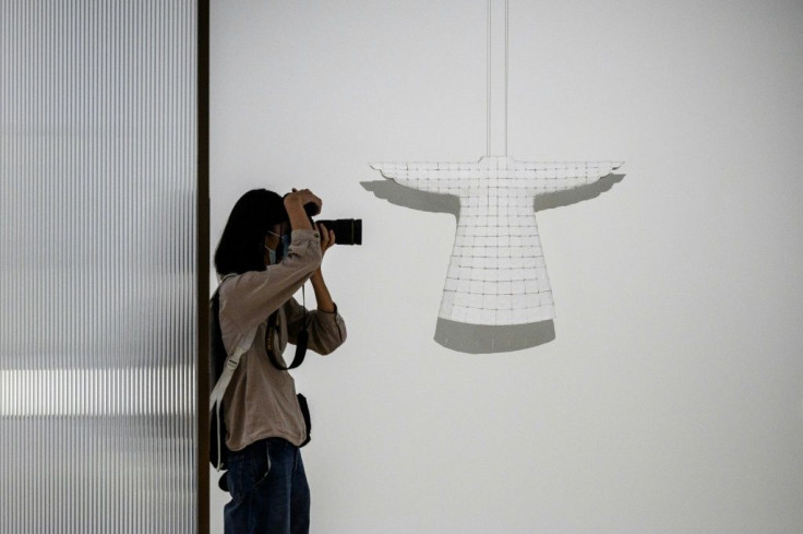 'Braiding' (R) by Chinese artist Ma Xiaojuan is on show at the Hong Kong Museum of Art exhibition