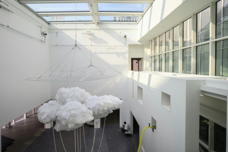 Hong Kong artist Keith Lam Yan Kit's 'Landscape of Cloud' (L) is one of the exhibits at the Hong Kong Museum of Art