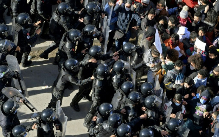In the face of limited reforms to Tunisia's security and judicial systems, activists say the risk of arrest places a 'sword of Damocles' over their heads