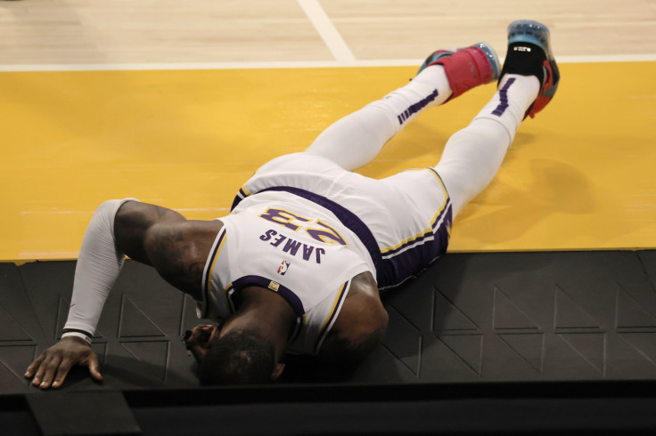 LeBron James #23 of the Los Angeles Lakers reacts to an apparent injury during the second period of a game against the Atlanta Hawks
