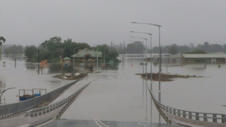 Scenes of a bridge swamped by water in Sydney's Windsor suburb on Tuesday as Australia's flooding disaster worsens.