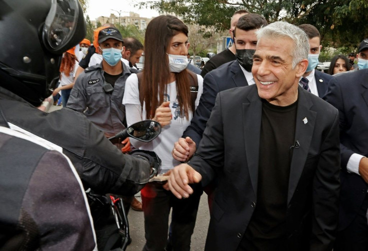 Israel's centrist former television anchor Yair Lapid, the prime minister's main challenger, outside a polling station in Tel Aviv