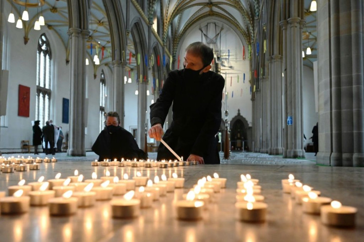 Vergers light 4,161 candles representing each death from Covid-19 in Lancashire, England
