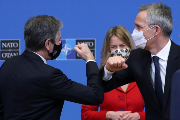 US Secretary of State Antony Blinken bumps elbows with NATO chief Jens Stoltenberg