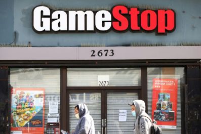 Shares of GameStop were volatile after the company reported mixed earnings