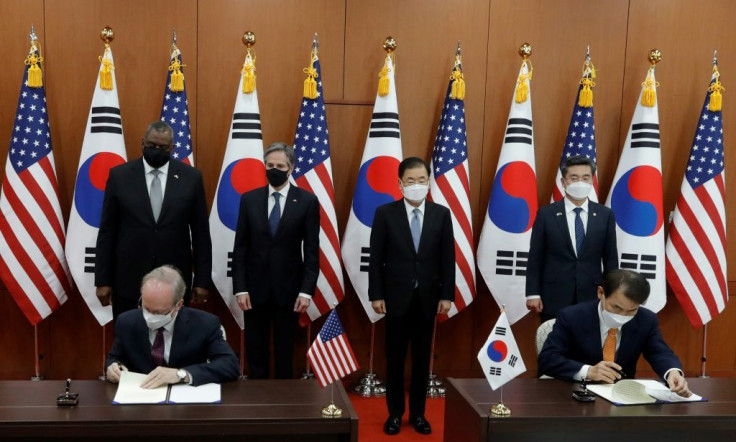 US Secretary of State Antony Blinken (2nd L) and US Defense Secretary Lloyd Austin (L) as well as South Korean Foreign Minister Chung Eui-yong (2nd R) and South Korean Defense Minister Suh Wook (R) look on during an initialing ceremony in Seoul on March 1