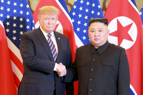 North Korean leader Kim Jong Un (R) shakes hands with then US president Donald Trump in Hanoi in February 2019