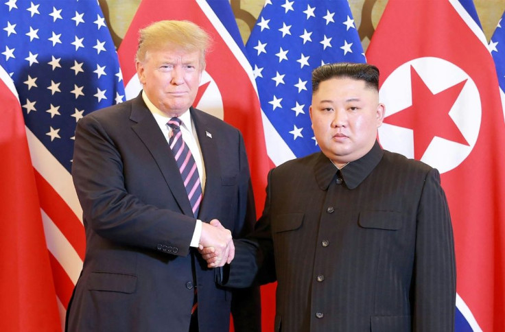 North Korean leader Kim Jong Un (R) shakes hands with then US president Donald Trump in Hanoi in February 2019