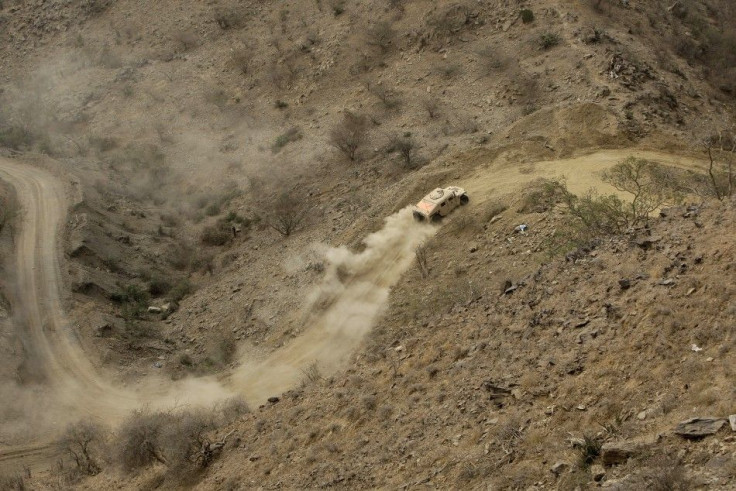 A Saudi military vehicle moves near the Khoba frontline border with Yemen