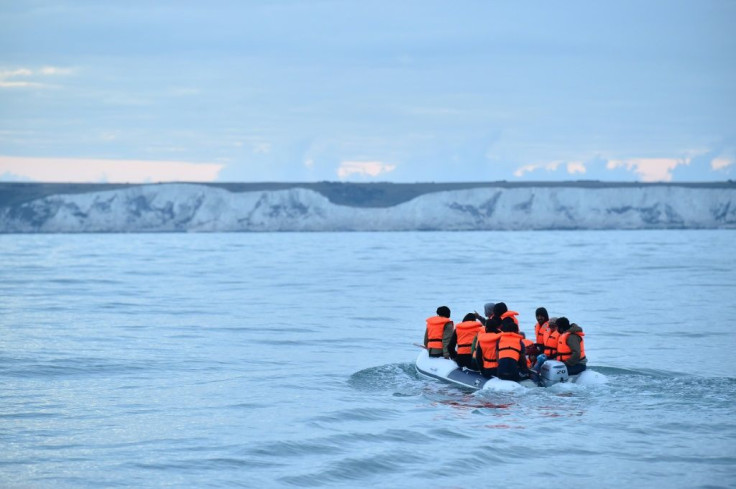 Migrants aboard a dinghy sail toward the south coast of England after crossing from France.