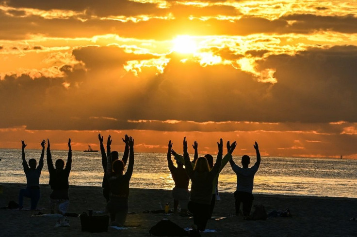 A yoga session in Miami Beach, Florida -- a stark contrast to the late-night party scene that has forced police to impose a curfew