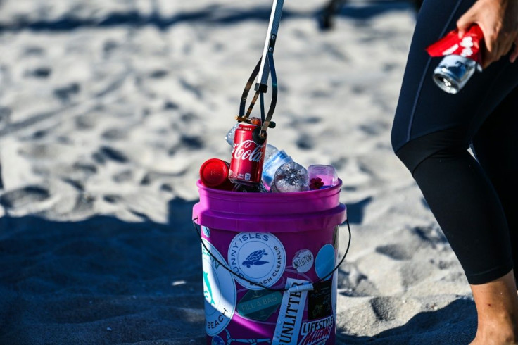 Sophie Ringel, founder of the nonprofit organization "Clean Miami Beach," collects trash left on the beach