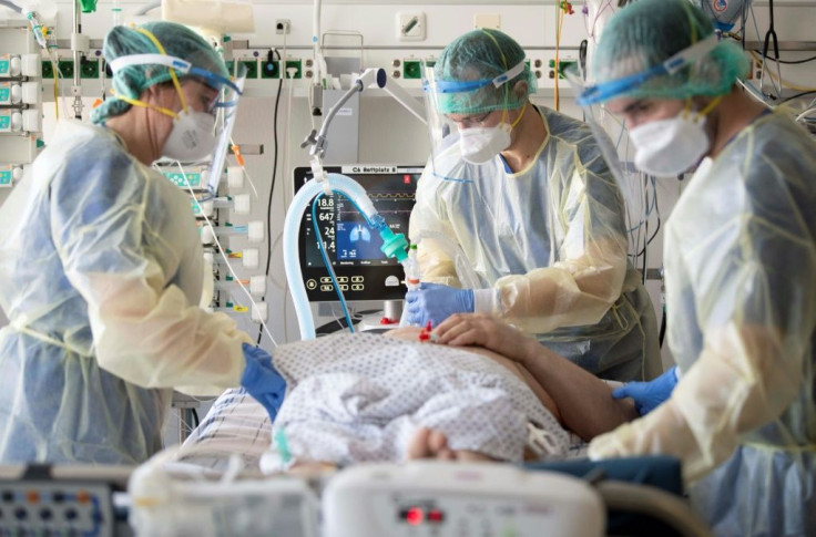 Medical staff take care of a patient in the Covid-19 intensive care unit of the Robert Bosch hospital in Stuttgart