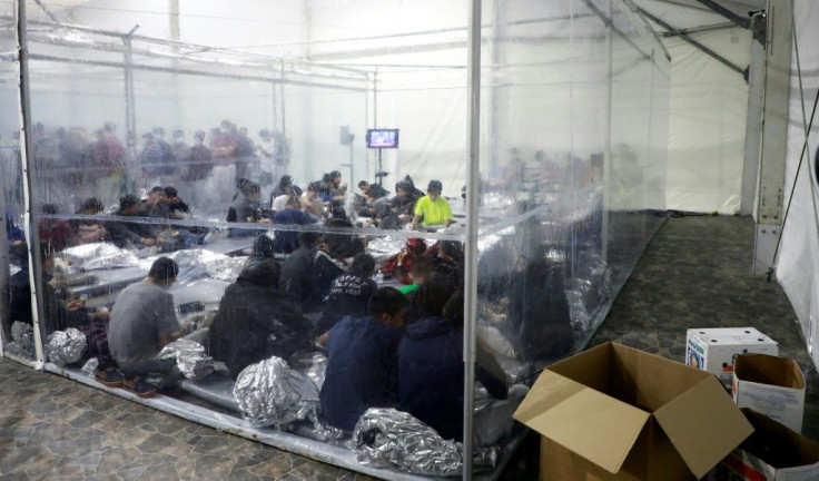 Migrants crowd a temporary processing center in Donna, Texas