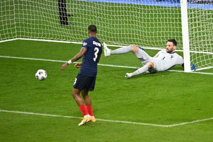 Kimpembe (L) scored an own goal against Ukraine
