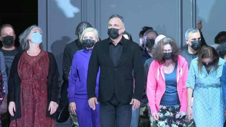 from the dress rehearsal of Faust, an opera by Charles GounodWorking in a tight-knit group, the choral artists of the Paris Opera have agreed to sing wearing facemasks, in addition to undergoing regular PCR tests, in order to continue accompanying soloist