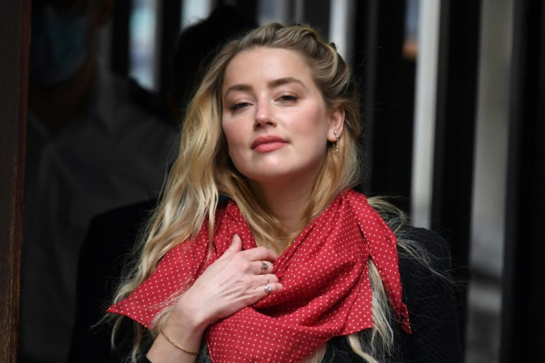 A spokeswoman for Amber Heard said she was was 'pleased -- but by no means surprised by the decision'