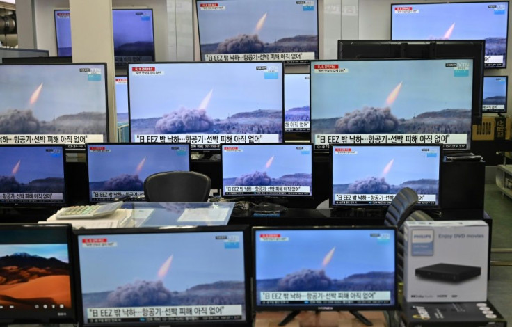 Televisions at a supermarket in Seoul show footage of two North Korean ballistic missile tests