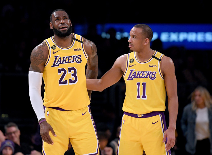  LeBron James #23 of the Los Angeles Lakers reacts to Avery Bradley #11 