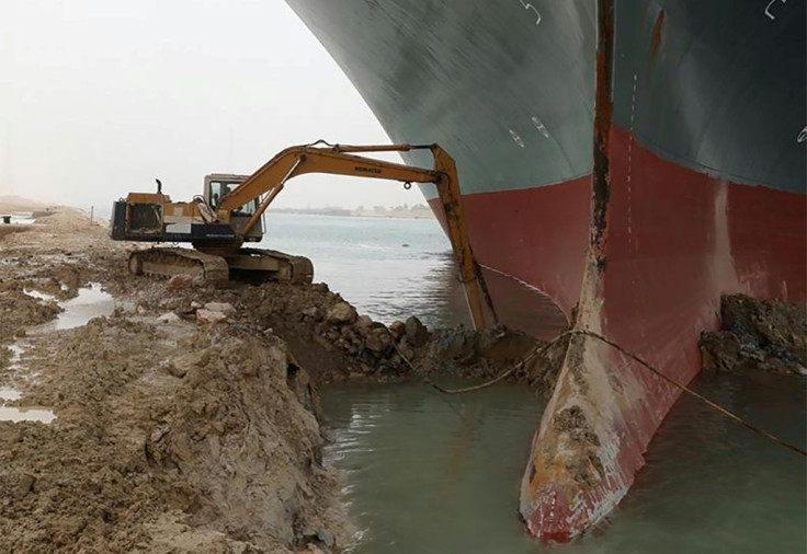 An excavator is used to dig out the MV Ever Given, a 400-metre- (1,300-foot) long vessel lodged across Egypt's Suez Canal