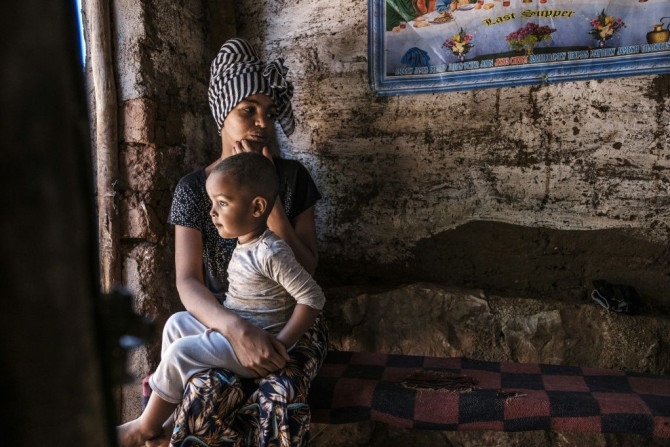 A refugee and her child, pictured at the Mai Aini camp for Eritrean refugees in Ethiopia in January. Thousands of refugees have flooded into the overcrowded facility since two other camps were destroyed, the UN says