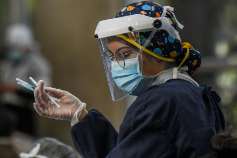 A nurse prepares shots of the CoronaVac vaccine  developed by China's Sinovac lab in Bogota