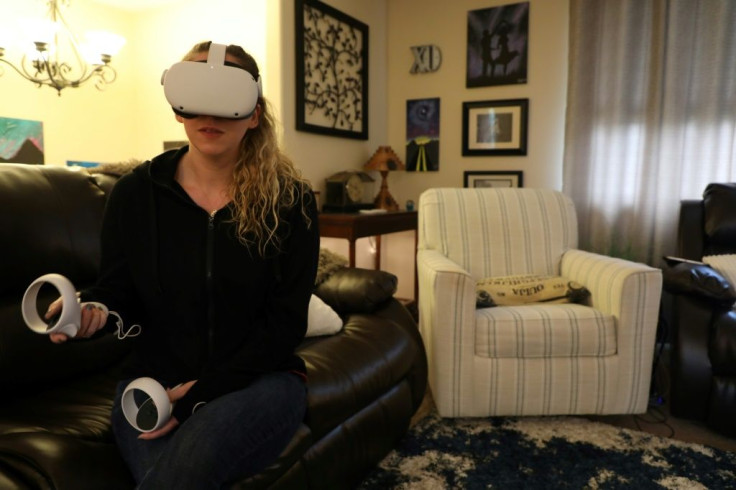 Amy Erdt, who manages a virtual reality Facebook group, sits in her living room in Oregon and travels to foreign cities virtually using her Oculus headset
