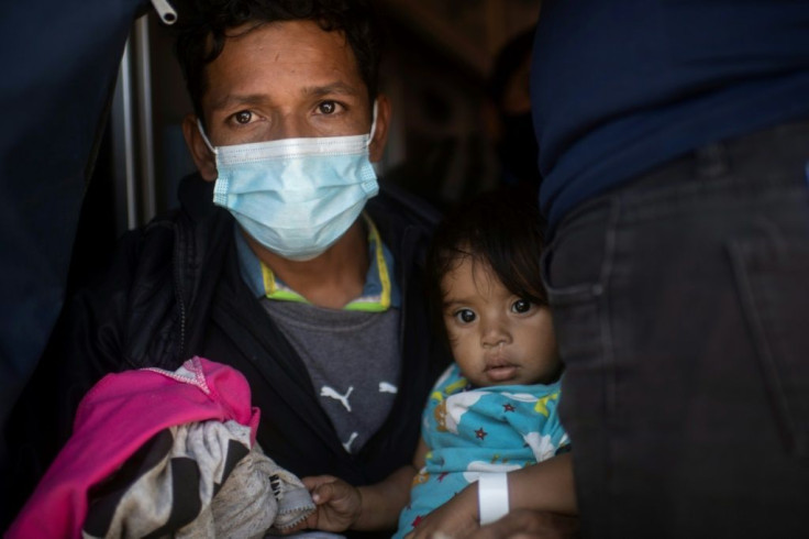 A mother and her child are deported from the United States to Mexico via the Paso del Norte border bridge