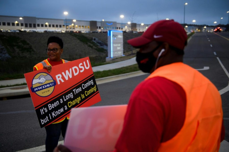 Union activists greet workers arriving at the Amazon plant in Bessemer, Alabama