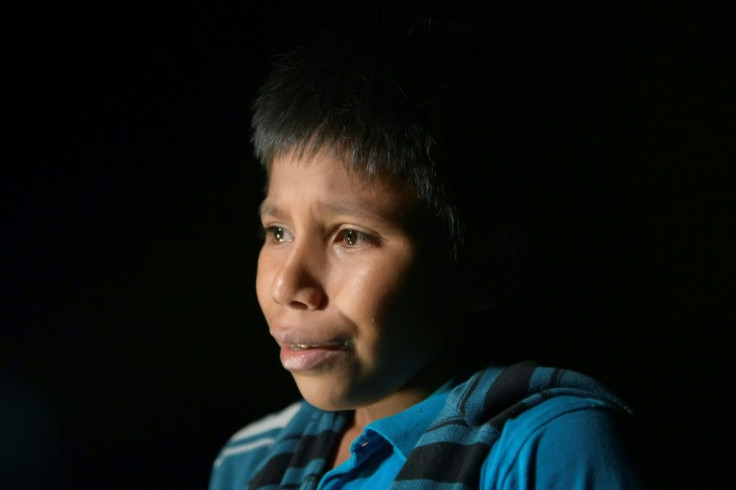 In a photo taken on March 27, 2021 in Roma, Texas, 12-year-old Oscar tearfully recounts his solo journey from his native Guatemala