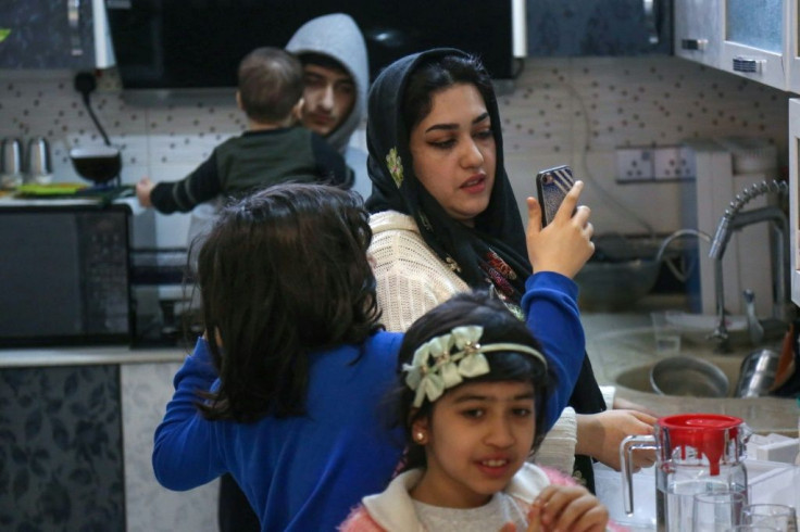 Mohsen's family go about household chores at home in Karbala