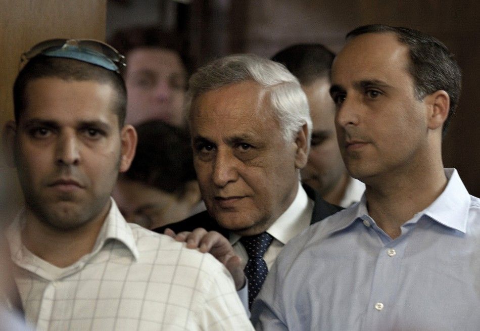 Former Israeli President Moshe Katsav C is seen inside the court room at a district court in Tel Aviv March 22, 2011. Katsav was sentenced on Tuesday to seven years in jail for rape, a case that brought shame to Israel039s highest office and sent a f