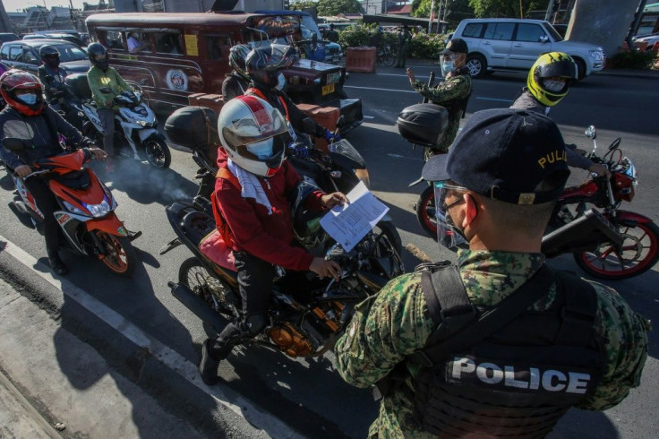 Traffic was backed up for hundreds of metres at checkpoints in the capital Manila as police tried to ensure only essential workers were travelling