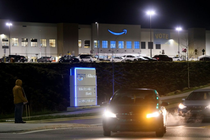 A union supporter stands outside during a shift change before sunrise at the Amazon.com, Inc. BHM1 fulfillment center on March 29 in Bessemer, Alabama, at the conclusion of a months-long organizing effort